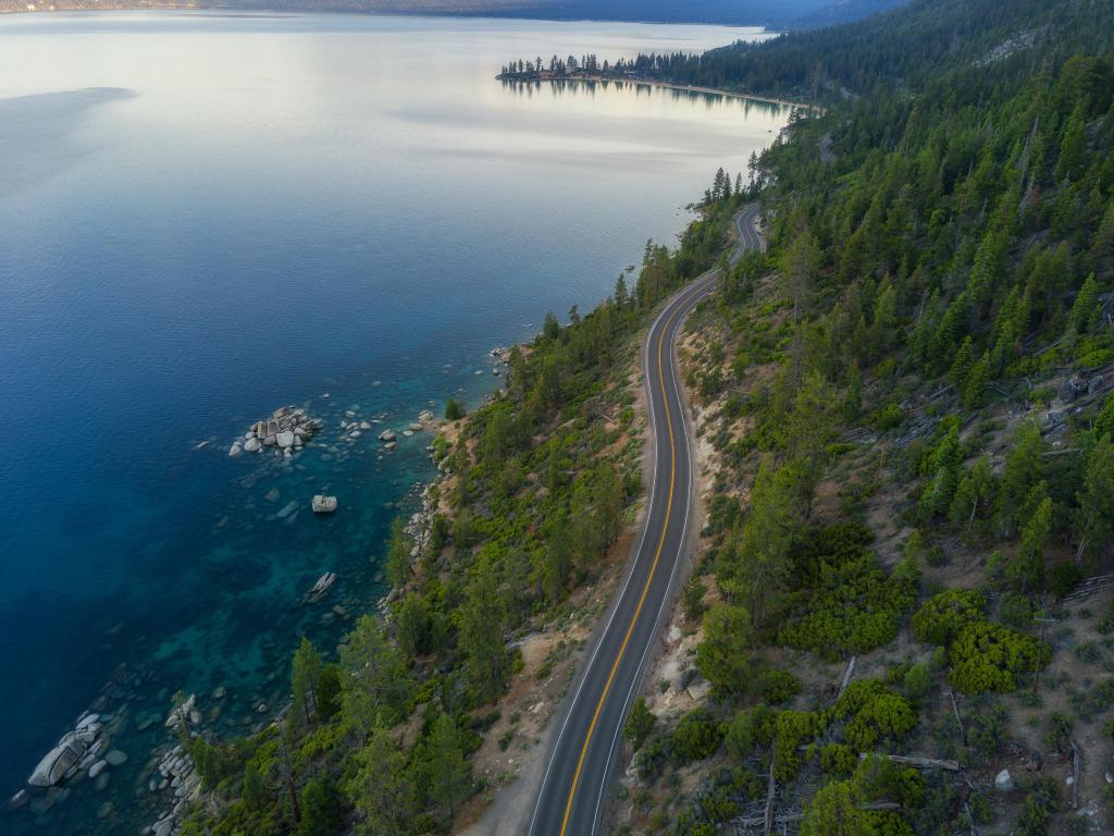 Aerial view of Lake Tahoe and the road around it.