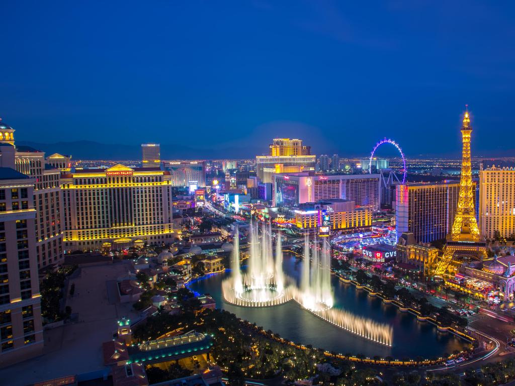 Las Vegas, USA with an illuminated view Bellagio Hotel fountains and Las Vegas strip taken at night.