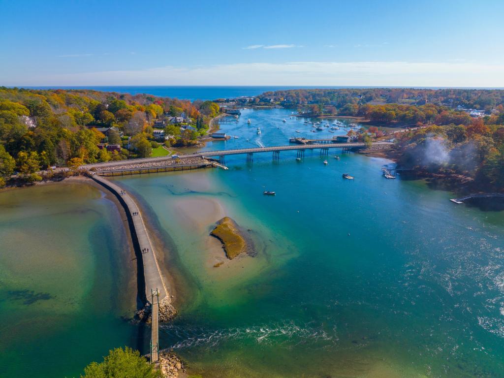 Wiggly Bridge at Barrell Mill Pond Dam spans the York River, near the river mouth to the York Harbor, town of York, Maine in fall