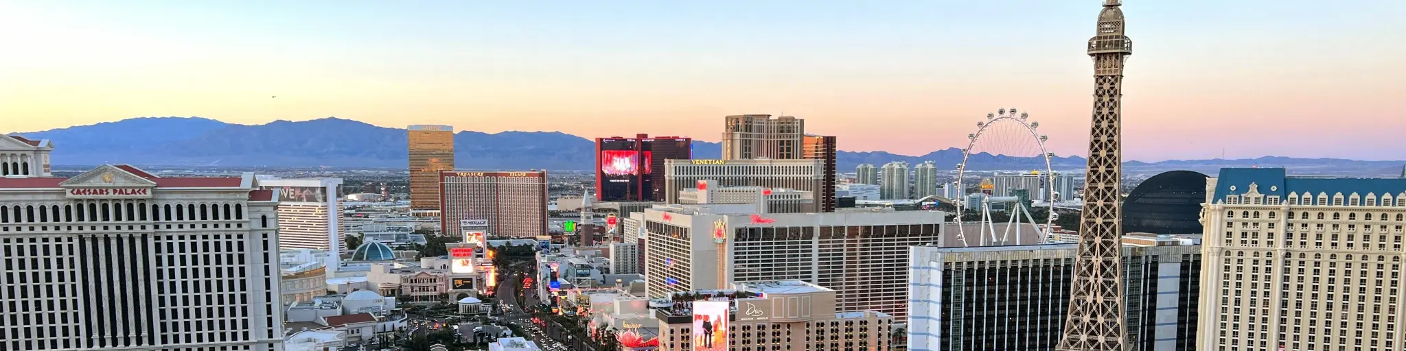 Aerial view of the Strip during dusk with famous hotels and casinos in focus