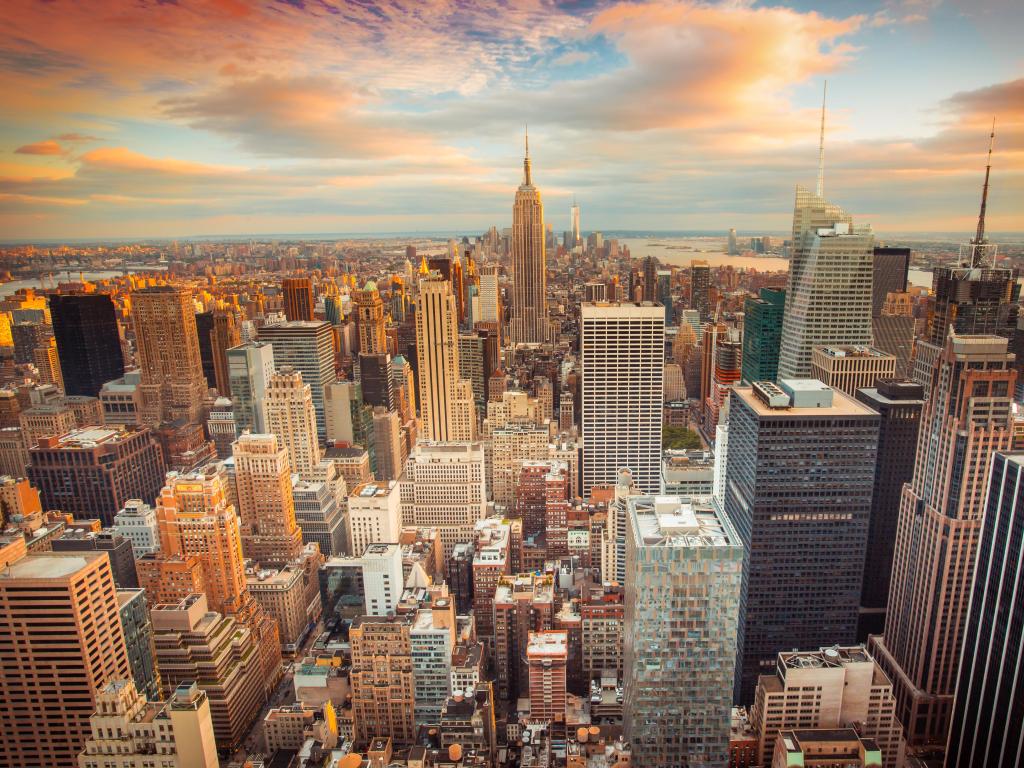 New York City, USA taken at sunset with an aerial view of the city looking over midtown Manhattan.