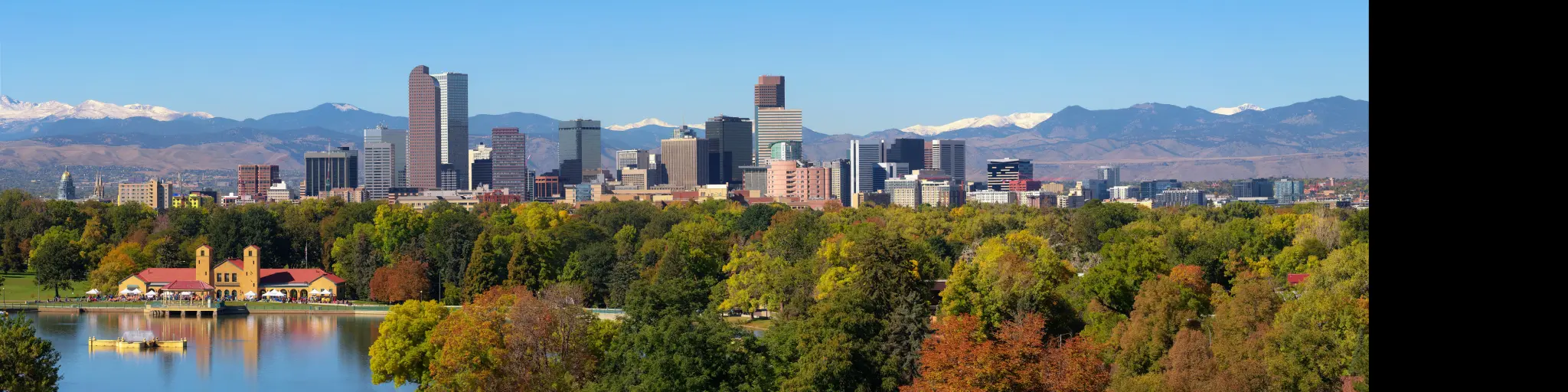 Denver city skyline with snow capped Rocky Mountains in the background