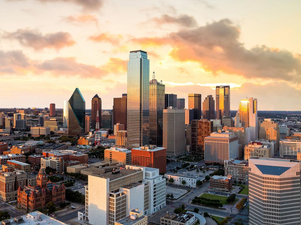 Skyline of downtown Dallas, Texas under a beautiful sky.