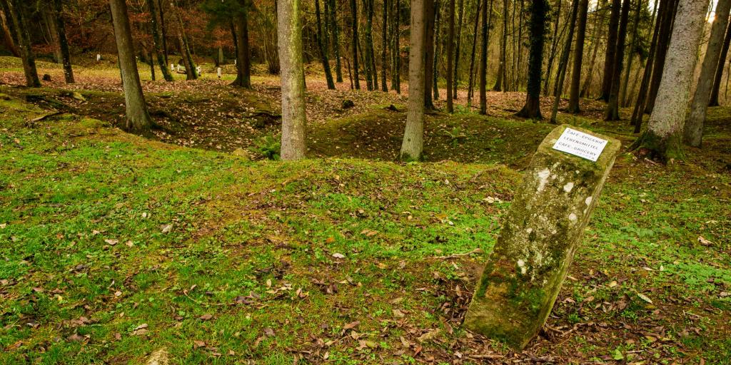 A post showing where a cafe and grocery store would once have stood in the village of Fleury-devant-Douaumont, France, which is now uninhabitable