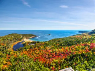 Panoramic view of the stunning fall colors and blue waters of the Bay in Acadia National Park