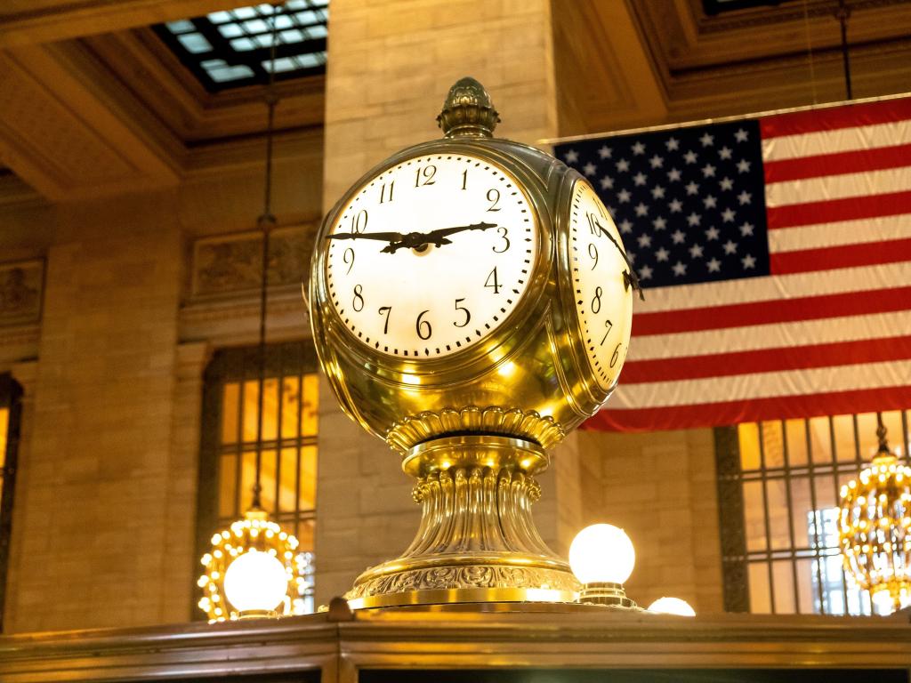 Vintage Clock and American flag in Grand Central Station, New York