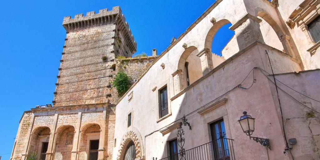 The turret of Ducal Castle, Ceglie Messapica against a blue sky 