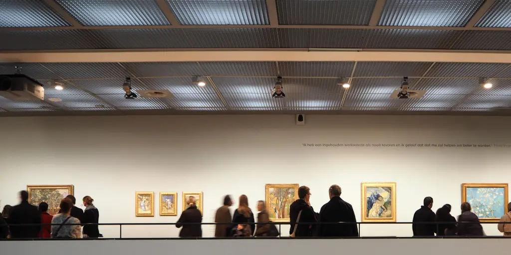People looking at the artwork in the Van Gogh Museum, Amsterdam 