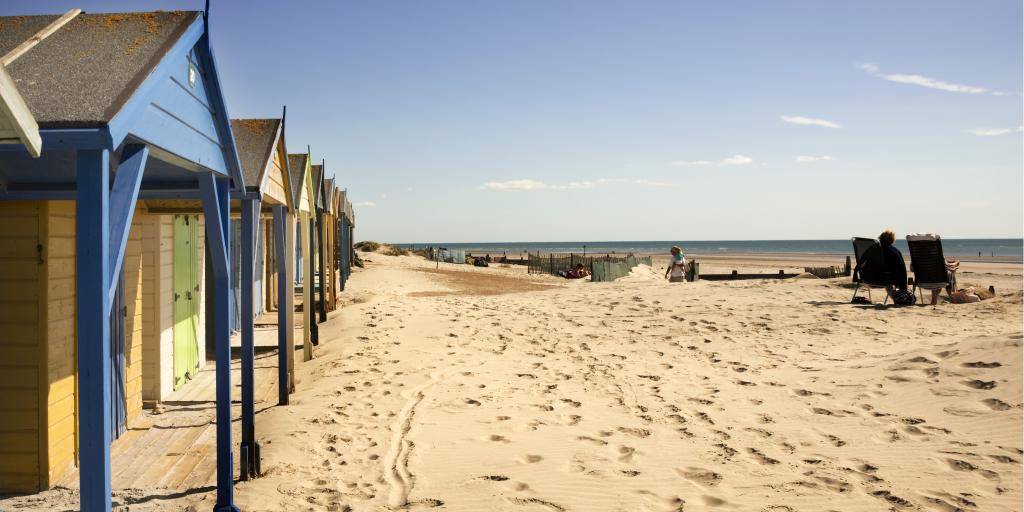 Colourful beach huts at West Wittering beach, Sussex 