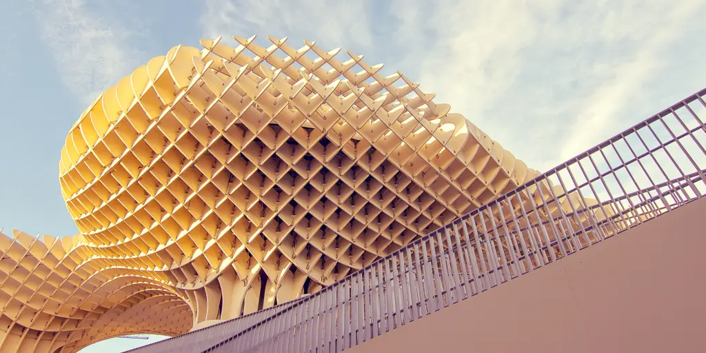 The wooden grid pattern of Metropol Parasol against a blue sky in Seville