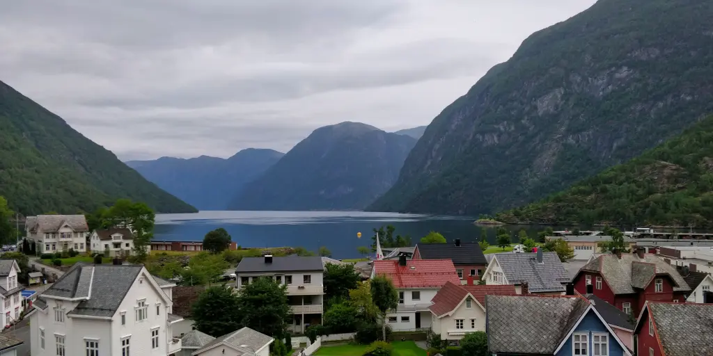 The houses of Hellesylt in Norway, with a beautiful fjord in the background