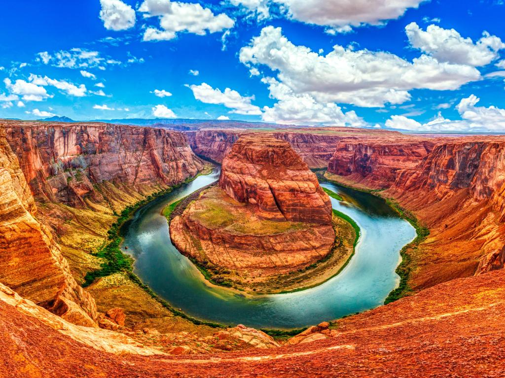 Horseshoe Bend, Glen Canyon, Arizona, USA with a stunning view of the meander of Colorado River on a sunny day.