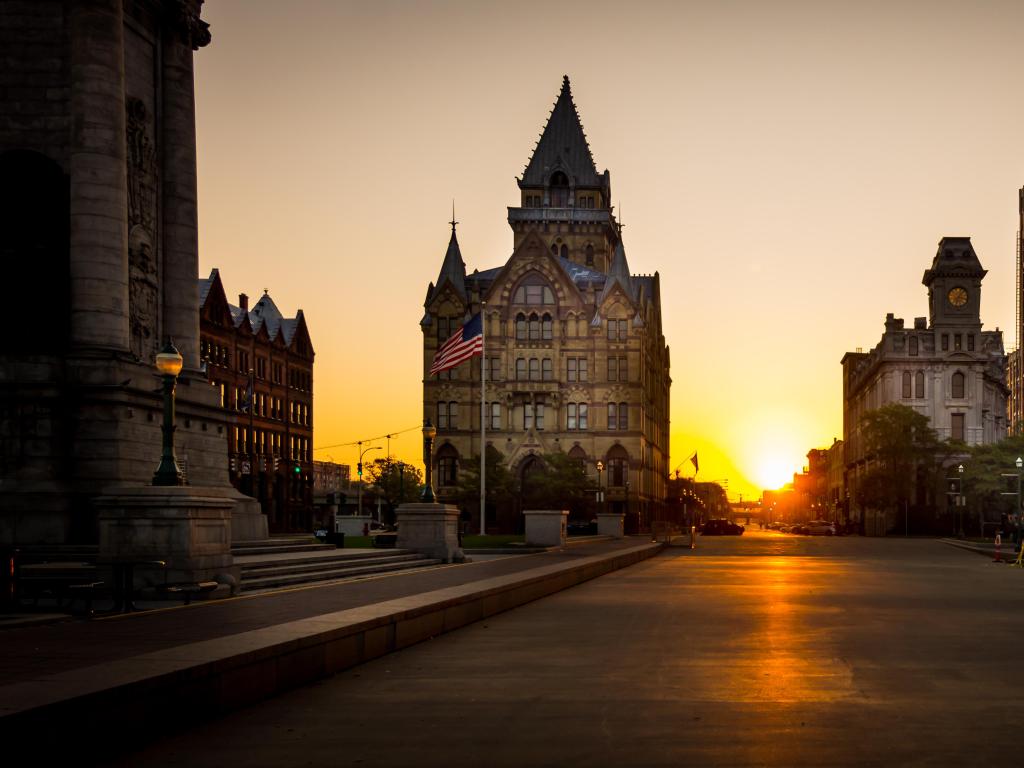 Syracuse, New York, USA taken with the downtown skyline in the background and taken at night, an American flag can be seen.