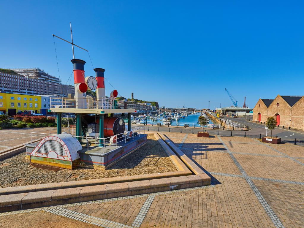  Part of St Helier harbour with the steam clock in the foreground and the Old Harbour in the background. Jersey, Channel Islands, uk