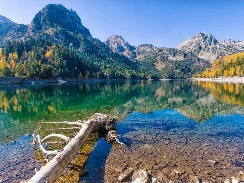 Lleida, Catalonia, Spain with perfect reflection within estany de Sant Maurici, Aiguestortes and Sant Maurici National Park, Lleida, Catalonia, Spain