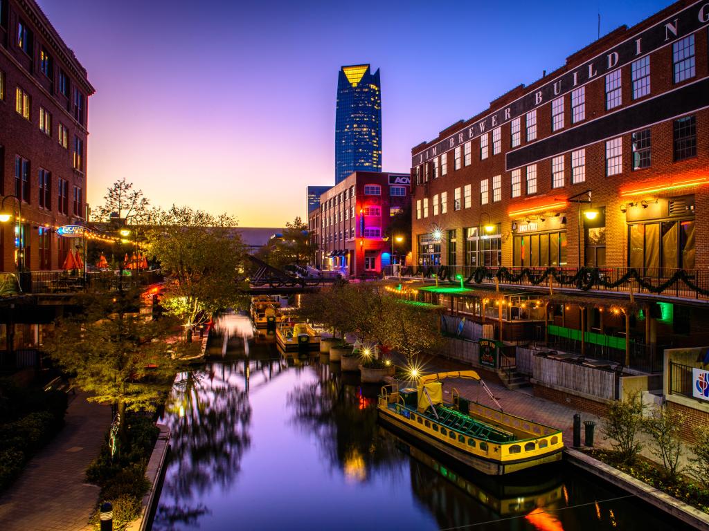 Oklahoma City, OK, USA taken at the Bricktown Entertainment District of Oklahoma City at night, with boats in the canal. 