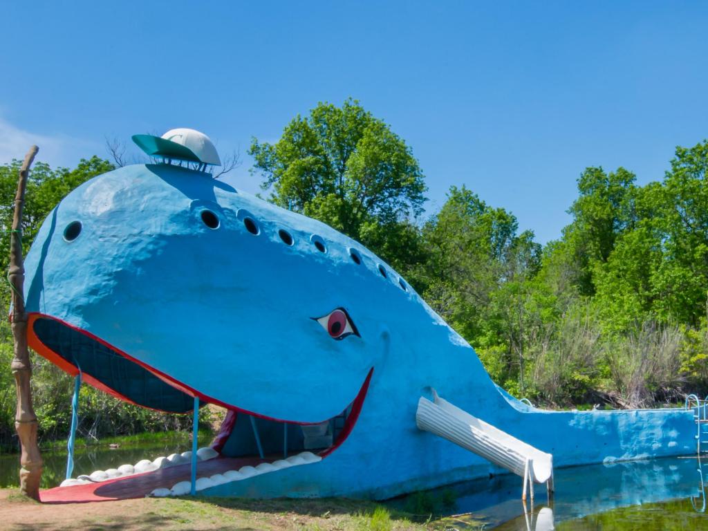 Iconic Blue Whale of Catoosa floating in Natures Acres pond