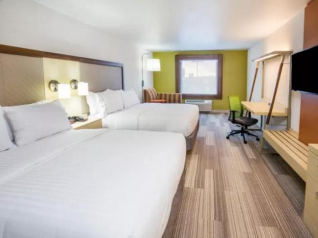 Large double beds, modern decor and desk area at Holiday Inn Express & Suites Pahrump, an IHG Hotel