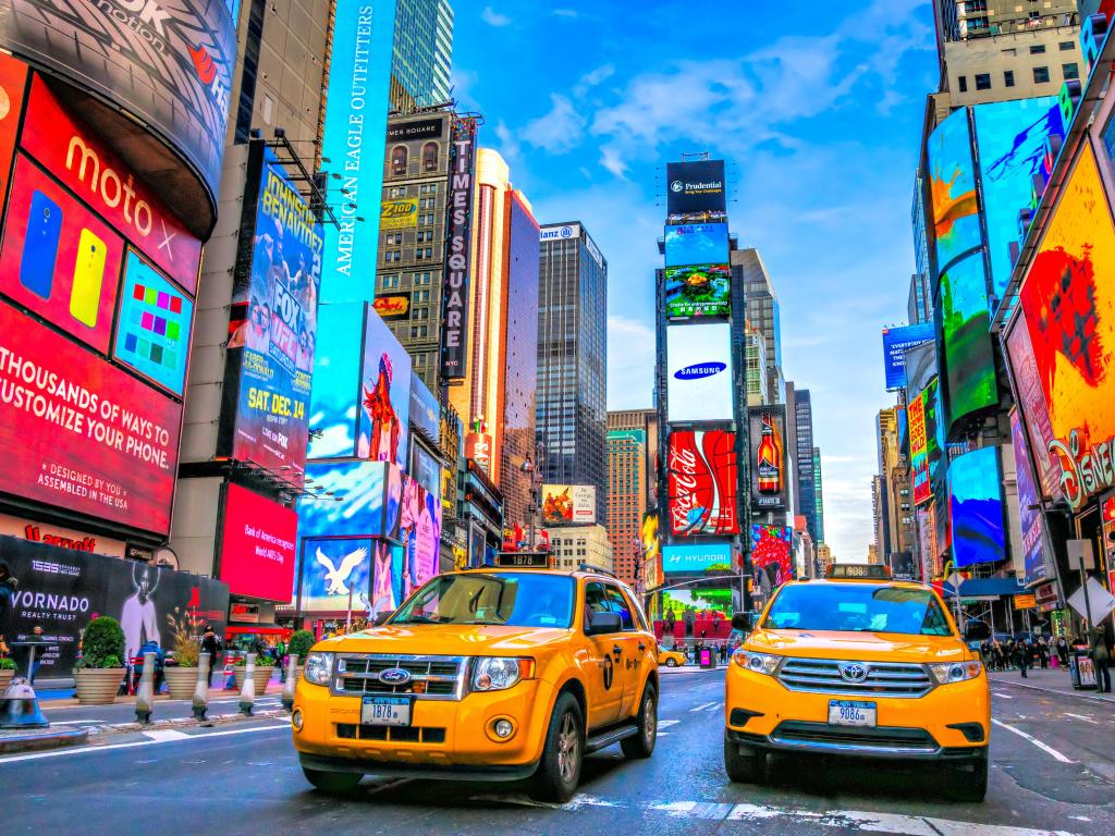 Times Square, New York, at daytime with yellow taxis