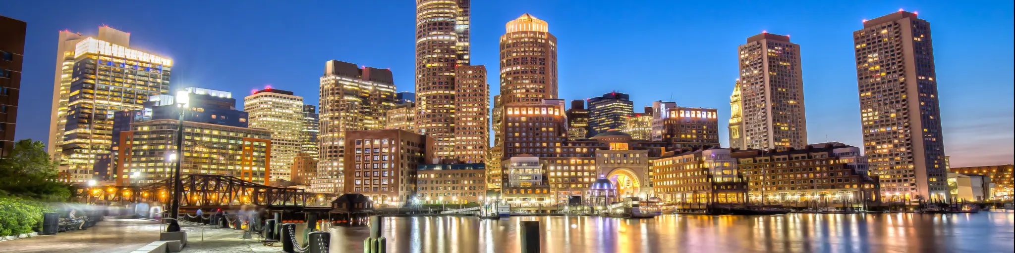 Downtown Boston as seen from Downtown Harborwalk at night - Boston, Massachusetts