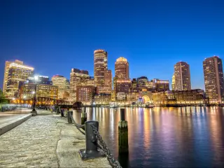 Downtown Boston as seen from Downtown Harborwalk at night - Boston, Massachusetts