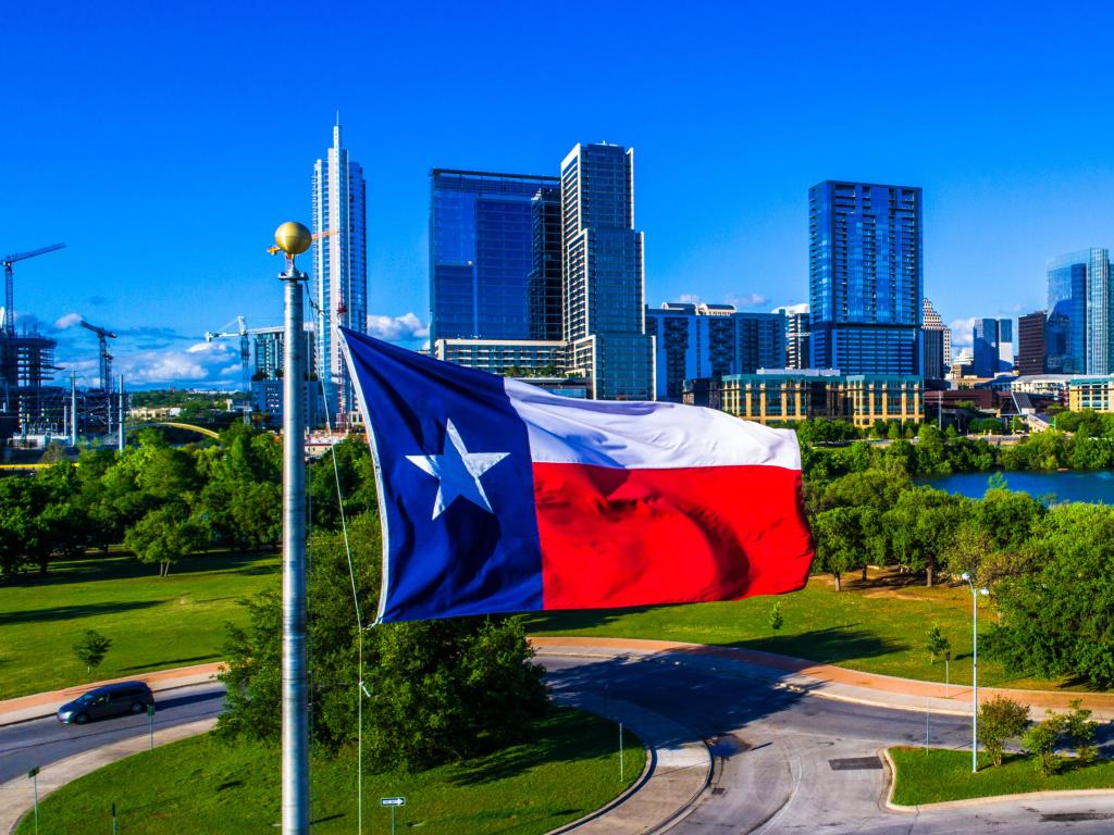 ATX City Skyline Texas Flag patriotic National Pride Displays the Lone Star State with a Colorful Austin Texas Skyline Cityscape Capital Cities Background on a Nice Sunny Summer Blue Sky Day