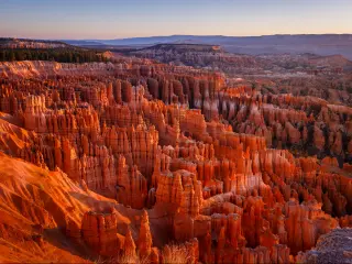 Inspiration Point during beautiful sunrise, with hoodoos - unique rock formations from sandstone made by geological erosion. Bryce National Park, Utah, USA