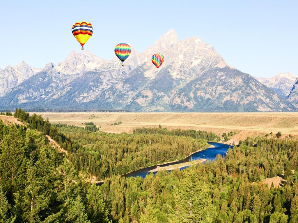 Snake River Overlook, photo taken in the morning with hot-air balloons rising in the blue sky