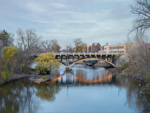 Bridge over calm Rum River Anoka Minnesota.