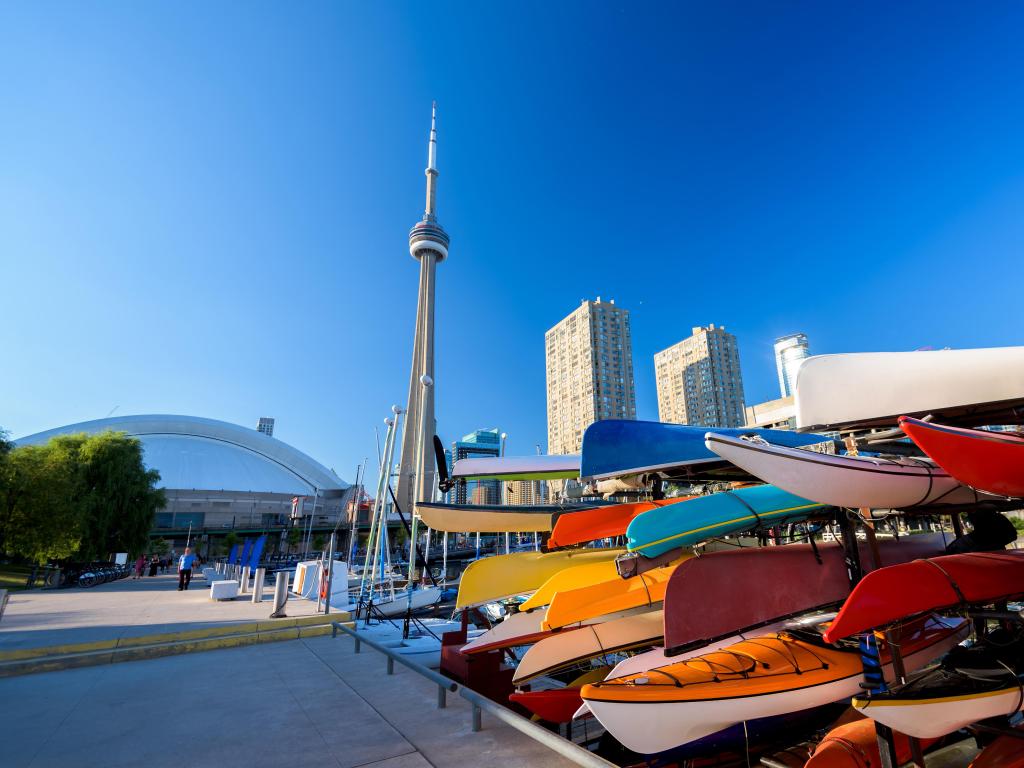 View of canoes in the harbor and Toronto Skyline, Canada