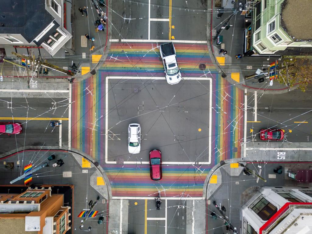 Aerial view of a cross-roads in the Castro with rainbow pedestrian crossings
