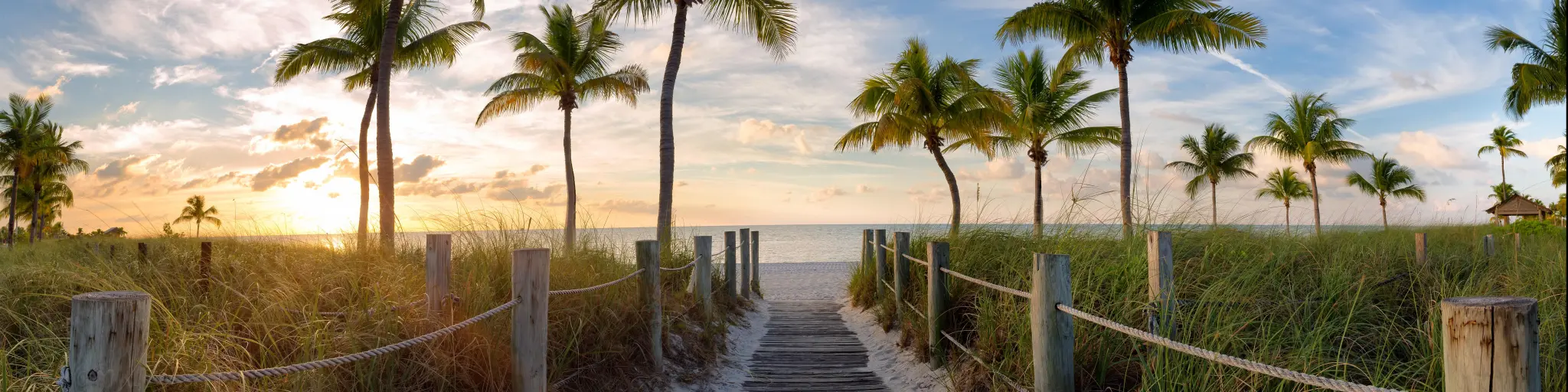 Panorama view of footbridge to the Smathers beach at sunrise - Key West, Florida, USA.