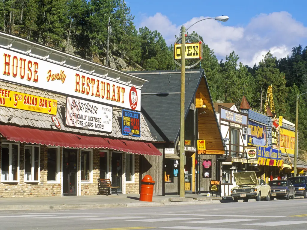 Traditional wooden store fronts line the main shopping street of Keystone South Dakota on a summer's day