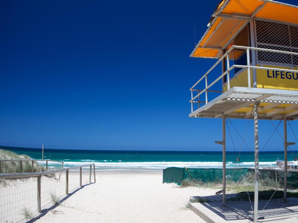 Lifeguard tower on Gold Coast Beach with white sand and no people, Queensland, Australia