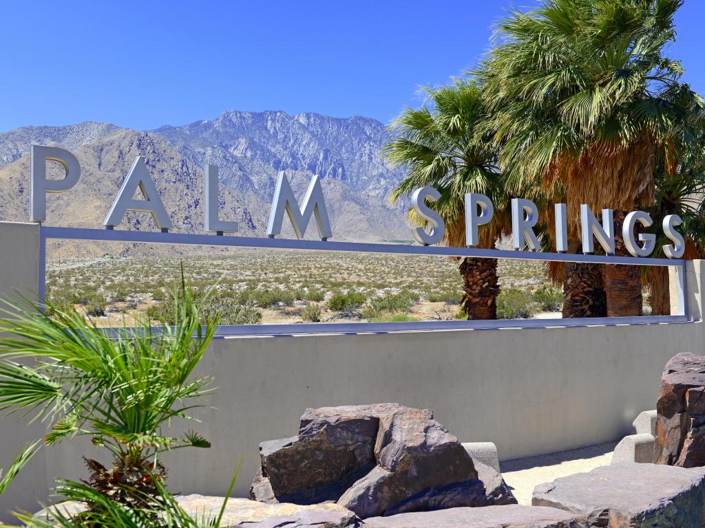 Palm Springs sign with desert background and backdrop of San Jacinto Mountain, California