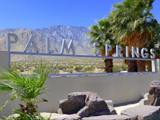 Palm Springs sign with desert background and backdrop of San Jacinto Mountain, California
