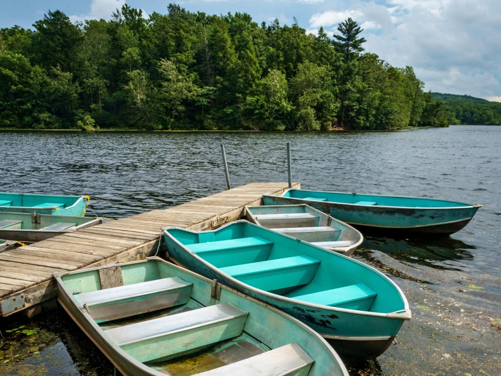 Colorful boats tied to the dock along the edge of Wawayanda Lake, Wawayanda State Park, New Jersey