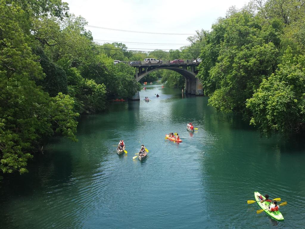Lady Bird Lake, Austin Tx, people canoeing in the bright waters