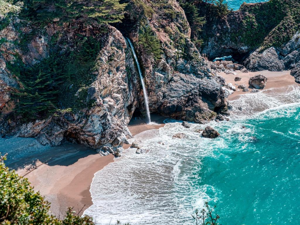 Aerial view of McWay Falls as the waterfall empties directly into the ocean