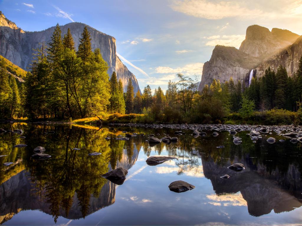 Yosemite Valley, Yosemite National Park, California, USA taken at sunrise with the lake in the foreground and mountains in the distance. 