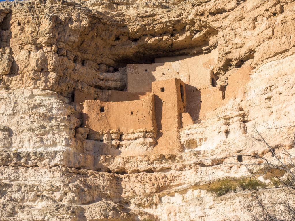 Camp Verde, Arizona, USA with a view of Montezuma Castle National Monument, cliff dwellings carved into the rock face on a sunny day.