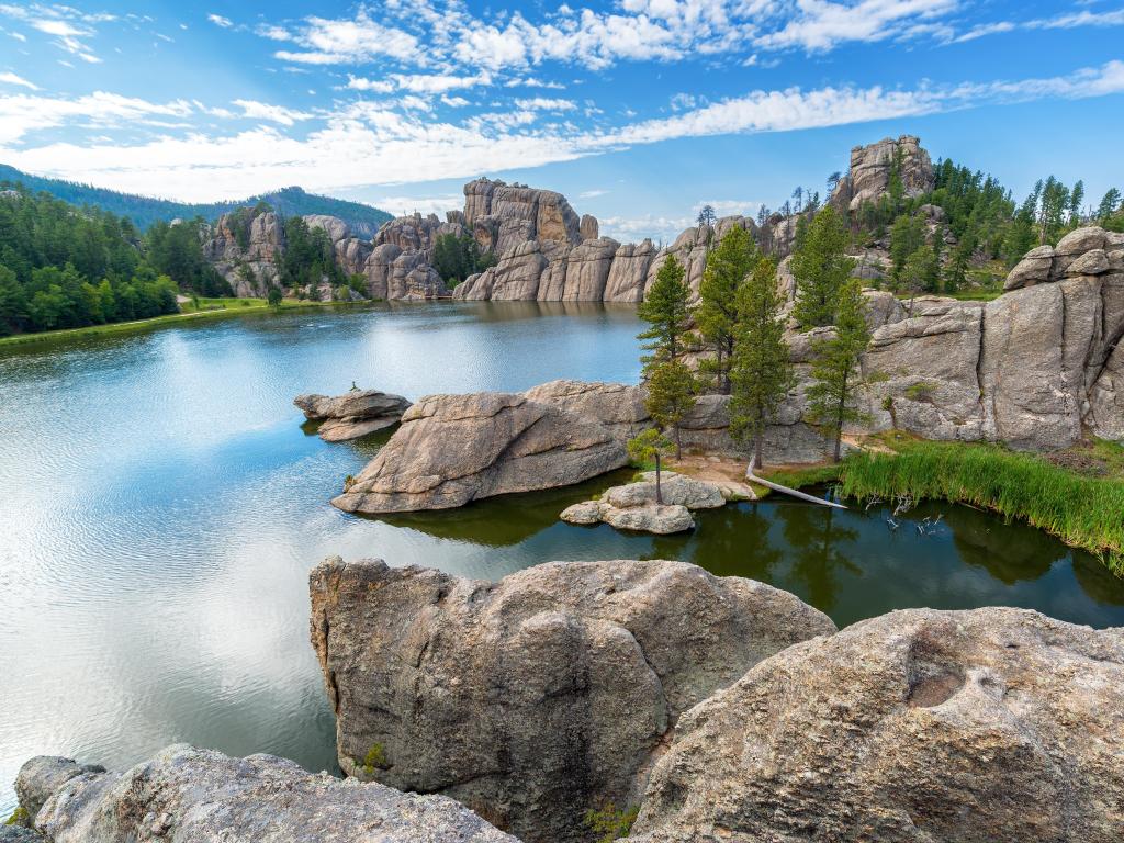 Custer State Park, USA with the beautiful Sylvan Lake surrounded by large rock formations on a sunny day.