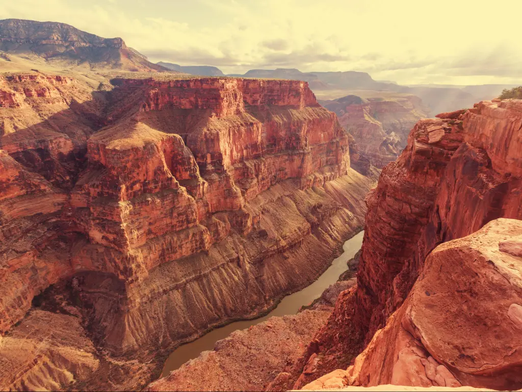 Grand Canyon, USA taken at sunset/sunrise with a soft glow on the towering canyons and the river snaking between them. 