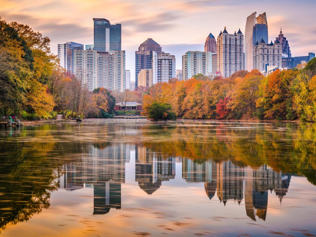 Atlanta, Georgia, USA Piedmont Park skyline in autumn on Lake Meer at dusk.