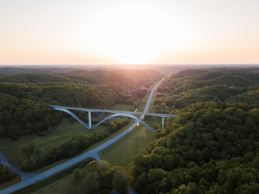 The sun rises over the Natchez Trace bridge in Franklin, TN at sunset.