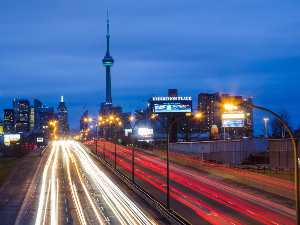 Long exposure of light trails on the Gardiner Expressway leading up to the CN Tower