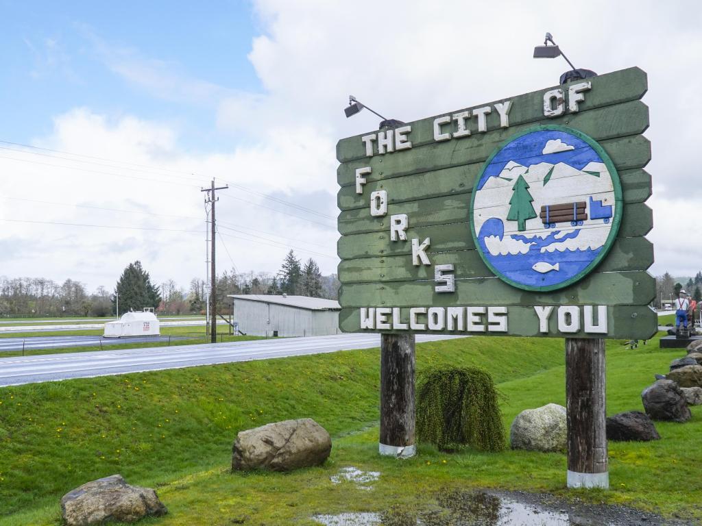 Close up of 'City of Forks Welcomes You' sign along the highway 