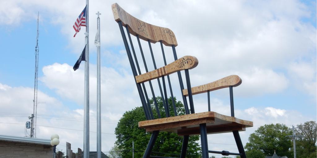 A car drives by the world's largest rocking chair in Casey, Illinois