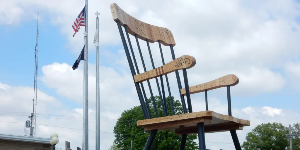 A car drives by the world's largest rocking chair in Casey, Illinois