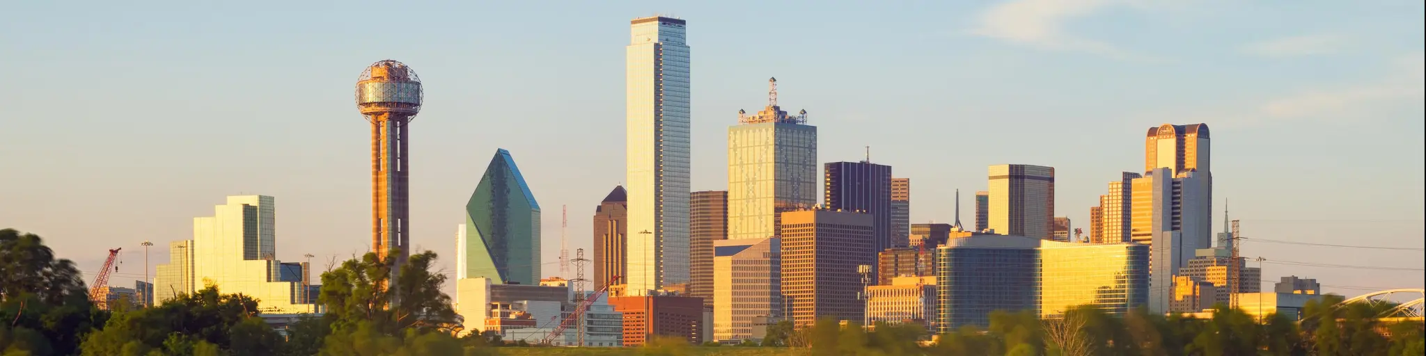Skyline of Dallas City, Texas, USA. The photo depicts the city's skyline reflected on water.
